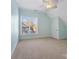 Spacious bedroom with light blue walls, ceiling fan, and large window at 2717 Madison Oaks Ct, Charlotte, NC 28226