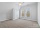 Bright bedroom with carpeted floor and large windows at 2717 Madison Oaks Ct, Charlotte, NC 28226