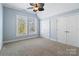 Spacious bedroom with carpeted floor and double doors at 2717 Madison Oaks Ct, Charlotte, NC 28226