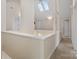 Upstairs hallway with skylights and carpet flooring at 2717 Madison Oaks Ct, Charlotte, NC 28226