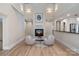 Two story living room with a fireplace and hardwood floors at 2717 Madison Oaks Ct, Charlotte, NC 28226