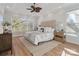 Bright bedroom with a king-size bed and hardwood floors at 2717 Madison Oaks Ct, Charlotte, NC 28226