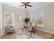 Home office with hardwood floors, large windows, and a workspace at 2717 Madison Oaks Ct, Charlotte, NC 28226