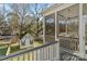 Screened porch with seating area overlooking the yard at 2717 Madison Oaks Ct, Charlotte, NC 28226