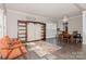 Dining room with a wooden table, chairs, and a view into the living room at 4115 Stuart Ln, Indian Land, SC 29707