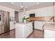 Kitchen with island, stainless steel appliances, and white cabinets at 4115 Stuart Ln, Indian Land, SC 29707