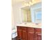 Double vanity bathroom with large mirror and dark wood cabinets at 5121 Stone Park Dr, Charlotte, NC 28269