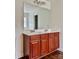 Double vanity bathroom with large mirror and dark wood cabinets at 5121 Stone Park Dr, Charlotte, NC 28269