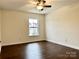 Bright bedroom with hardwood floors and large window at 5121 Stone Park Dr, Charlotte, NC 28269