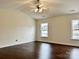 Spacious bedroom with hardwood floors and two windows at 5121 Stone Park Dr, Charlotte, NC 28269