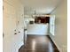 Bright dining room with hardwood floors and kitchen view at 5121 Stone Park Dr, Charlotte, NC 28269