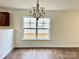 Dining area with hardwood floors and view to backyard at 5121 Stone Park Dr, Charlotte, NC 28269