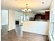 Dining room features hardwood floors and chandelier at 5121 Stone Park Dr, Charlotte, NC 28269