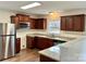 Kitchen with granite countertops and dark wood cabinets at 5121 Stone Park Dr, Charlotte, NC 28269