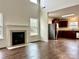 Open living room with hardwood floors and kitchen view at 5121 Stone Park Dr, Charlotte, NC 28269