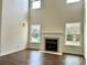 Bright living room featuring a fireplace and hardwood floors at 5121 Stone Park Dr, Charlotte, NC 28269