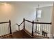 View of the upstairs with a staircase and open living area at 5121 Stone Park Dr, Charlotte, NC 28269