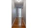 Long hallway with hardwood floors and access to bathroom at 6050 Mcconnells Hwy, McConnells, SC 29726