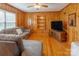 Living room with wood paneled walls, hardwood floors, and built-in shelving at 6050 Mcconnells Hwy, McConnells, SC 29726