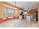 Bright kitchen featuring white cabinets, granite countertops, stainless steel appliances, and a bay window at 6654 Kingbird Ct, Charlotte, NC 28215