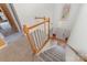 Classic staircase with wood railings and plush carpet runners leading to the upper level at 6654 Kingbird Ct, Charlotte, NC 28215