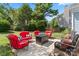 Outdoor seating around a fire pit provides a cozy backyard patio, perfect for entertaining guests at 8523 Albury Walk Ln, Charlotte, NC 28277