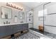 Modern bathroom with dual sinks, black fixtures, decorative tile, a framed shower, and a window at 8523 Albury Walk Ln, Charlotte, NC 28277