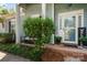 Cozy front porch with seating area, lush greenery, and a welcoming entrance with a decorative door at 8523 Albury Walk Ln, Charlotte, NC 28277