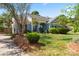 Charming single-story home with well-manicured lawn and a tree-lined yard with beautiful landscaping at 8523 Albury Walk Ln, Charlotte, NC 28277