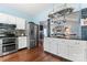 Bright kitchen features stainless appliances, a kitchen island, and hardwood floors at 8523 Albury Walk Ln, Charlotte, NC 28277