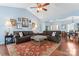 Spacious living room featuring hardwood floors, two sofas, and an ornate area rug at 8523 Albury Walk Ln, Charlotte, NC 28277