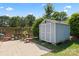 Backyard shed has a lawn and patio area at 8523 Albury Walk Ln, Charlotte, NC 28277