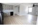 Spacious living room featuring new floors, neutral paint, black appliances and plenty of natural light at 868 Monarch Pl, Kershaw, SC 29067