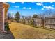 Backyard with wooden fence and trees at 111 Lois Ct, Statesville, NC 28625