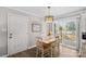Charming dining area with white table and chairs, near sliding glass doors to deck at 111 Lois Ct, Statesville, NC 28625
