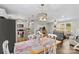 Light and airy dining area with white table and chairs, and kitchen views at 111 Lois Ct, Statesville, NC 28625