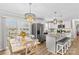 Bright kitchen with granite island, stainless steel appliances, and access to deck at 111 Lois Ct, Statesville, NC 28625