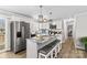 Modern kitchen with granite countertops and island seating at 111 Lois Ct, Statesville, NC 28625