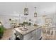 Open concept kitchen with granite island, stainless steel appliances, and views to living room at 111 Lois Ct, Statesville, NC 28625