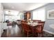 Open dining area with hardwood floors and access to living room at 13913 Queens Harbor Rd, Charlotte, NC 28278