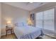 Cozy bedroom with light blue bedding and large window at 17627 Caddy Ct, Charlotte, NC 28278