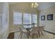 Bright dining area with glass table and four chairs at 17627 Caddy Ct, Charlotte, NC 28278