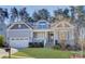 Two-story house with gray siding, stone accents, and a front porch at 17627 Caddy Ct, Charlotte, NC 28278