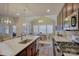 Modern kitchen features island with seating and stainless steel appliances at 17627 Caddy Ct, Charlotte, NC 28278