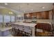 Island kitchen with breakfast bar and white countertops at 17627 Caddy Ct, Charlotte, NC 28278