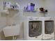 Well-equipped laundry area with modern washer and dryer, utility sink, and storage shelves at 17627 Caddy Ct, Charlotte, NC 28278
