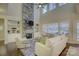 Spacious living room with stone fireplace, high ceilings and large windows at 17627 Caddy Ct, Charlotte, NC 28278