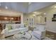 Open living room features a kitchen and breakfast bar at 17627 Caddy Ct, Charlotte, NC 28278