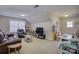 Large living area with comfortable leather seating, entertainment center, and workspace at 17627 Caddy Ct, Charlotte, NC 28278