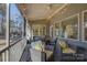 Covered porch with string lights and wicker furniture at 17627 Caddy Ct, Charlotte, NC 28278
